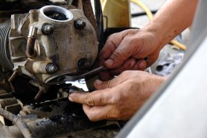 Set,the,motorcycle,engine,valve,by,a,motorcycle,mechanic.